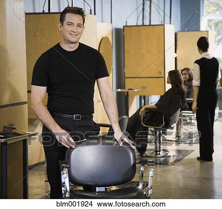 Picture - Male hair stylist in salon. Fotosearch