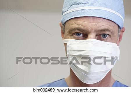 Male medical professional wearing surgical mask View Large Photo Image Stock Photo - Male medical professional wearing surgical mask. Fotosearch