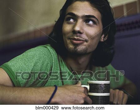 Man drinking coffee in cafe View Large Photo Image Stock Photo - Man drinking coffee in cafe. Fotosearch