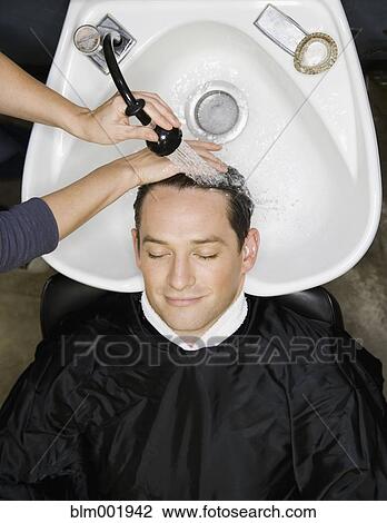 Man having hair washed at salon View Large Photo Image Stock Image - Man having hair washed at salon. Fotosearch