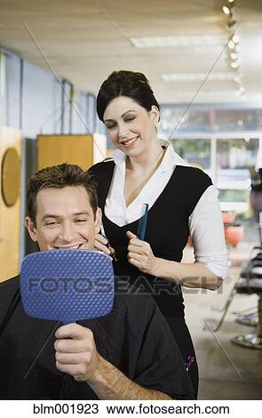 Man looking at hair in salon View Large Photo Image Stock Image - Man looking at hair in salon. Fotosearch