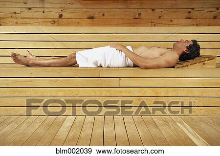 Stock Photo - Man relaxing in sauna. Fotosearch