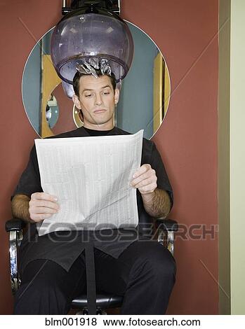 Stock Photo - Man under hair dryer in salon. Fotosearch