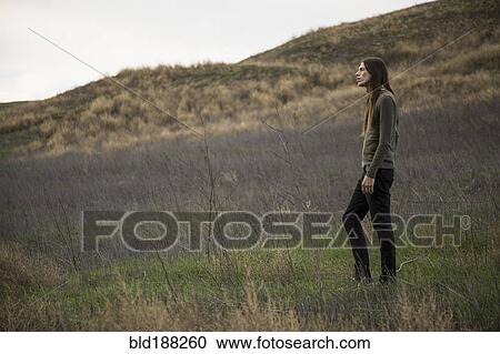 Man walking in rural field View Large Photo Image Stock Image - Man walking in rural field. Fotosearch