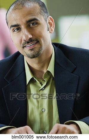 Middle Eastern businessman smiling View Large Photo Image Stock Photography - Middle Eastern businessman smiling. Fotosearch