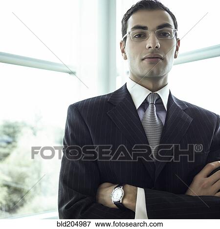 Stock Photo - Middle Eastern businessman with arms crossed. Fotosearch