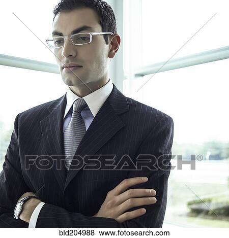 Stock Photo - Middle Eastern businessman with arms crossed. Fotosearch