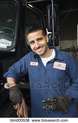 Stock Photo - Middle Eastern mechanic in repair shop. Fotosearch