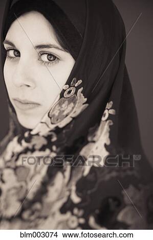 Picture - Middle Eastern teenager in headscarf. Fotosearch