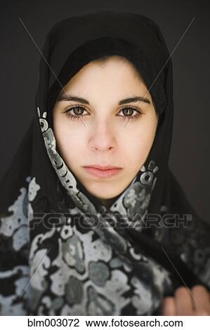 Stock Image - Middle Eastern teenager in headscarf. Fotosearch