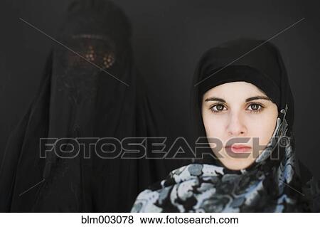 Middle Eastern woman in burka and teenager in headscarf View Large Photo Image Stock Photo - Middle Eastern woman in burka and teenager in headscarf. Fotosearch