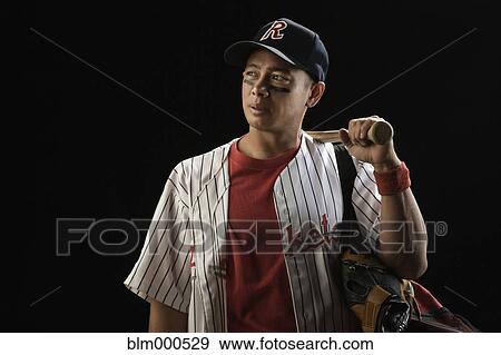 Mixed race baseball player holding bat View Large Photo Image Stock Photo - Mixed race baseball player holding bat. Fotosearch