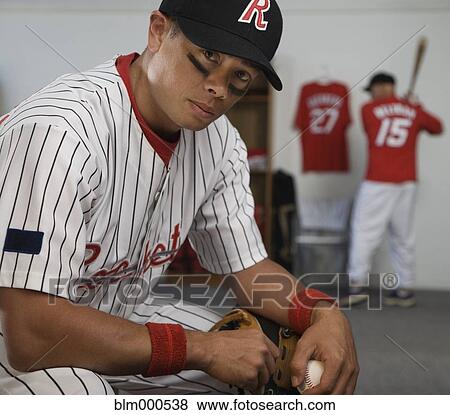 Mixed race baseball player in locker room View Large Photo Image Stock Photo - Mixed race baseball player in locker room. Fotosearch