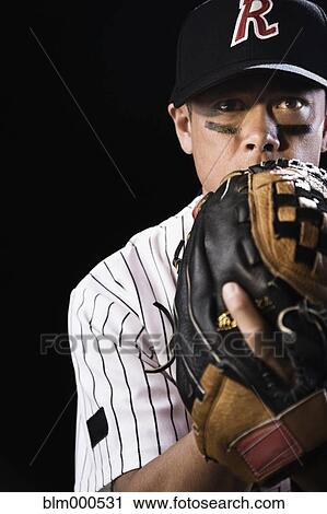 Mixed race baseball player pitching View Large Photo Image Stock Image - Mixed race baseball player pitching. Fotosearch