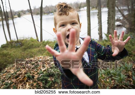 Mixed race boy shouting outdoors View Large Photo Image Stock Photography - Mixed race boy shouting outdoors. Fotosearch