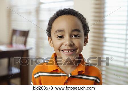 Stock Photo - Mixed race boy smiling. Fotosearch