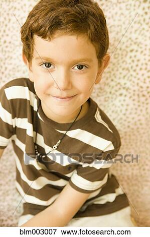 Stock Photo - Mixed race boy smiling. Fotosearch