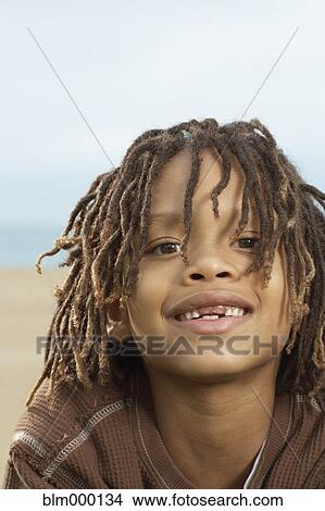 Picture - Mixed Race boy with dreadlocks. Fotosearch