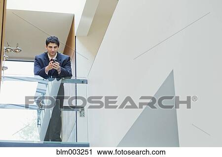 Mixed race businessman looking at laptop View Large Photo Image Stock Image - Mixed race businessman looking at laptop. Fotosearch