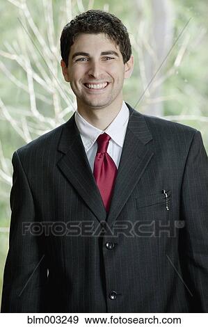 Stock Photo - Mixed race businessman smiling. Fotosearch