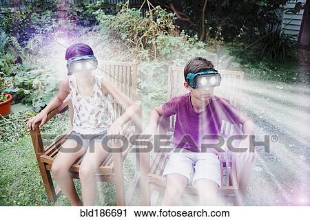 Mixed race children watching virtual reality screens View Large Photo Image Stock Image - Mixed race children watching virtual reality screens. Fotosearch