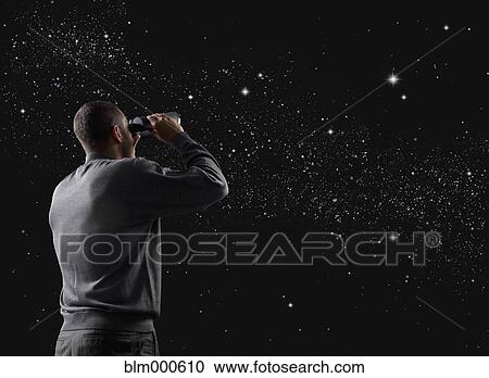 Mixed race man looking at stars in night sky View Large Photo Image Stock Image - Mixed race man looking at stars in night sky. Fotosearch