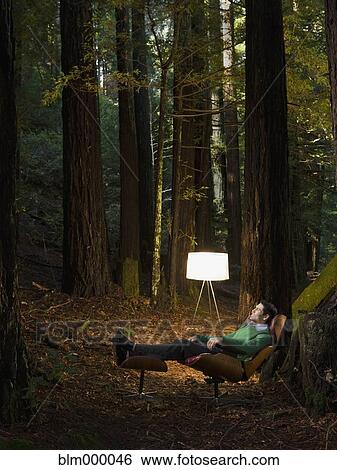 Mixed Race man relaxing in woods View Large Photo Image Stock Photograph - Mixed Race man relaxing in woods. Fotosearch