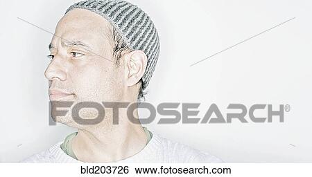Mixed race man wearing cap View Large Photo Image Stock Photograph - Mixed race man wearing cap. Fotosearch