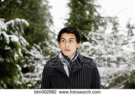 Stock Image - Mixed race standing outdoors. Fotosearch