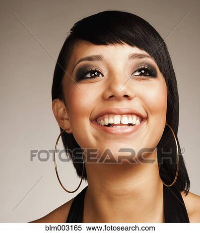 Stock Photography - Mixed race teenage girl smiling. Fotosearch