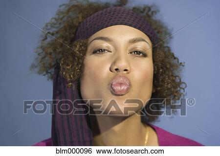 Mixed Race woman blowing kiss View Large Photo Image Stock Photograph - Mixed Race woman blowing kiss. Fotosearch