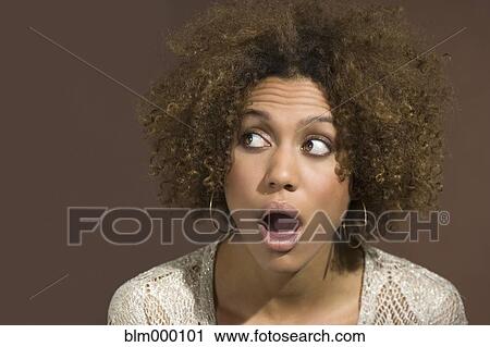 Mixed Race woman looking surprised View Large Photo Image Stock Image - Mixed Race woman looking surprised. Fotosearch