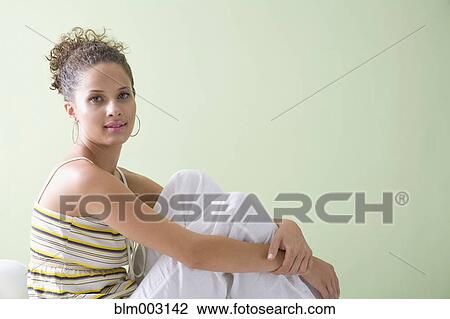 Mixed race woman relaxing View Large Photo Image Stock Image - Mixed race woman relaxing. Fotosearch