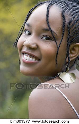 Stock Photo - Mixed race woman smiling. Fotosearch
