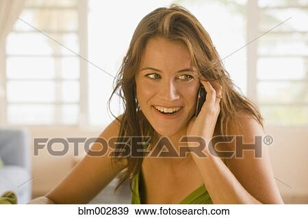 Mixed race woman talking on cell phone View Large Photo Image Stock Photo - Mixed race woman talking on cell phone. Fotosearch