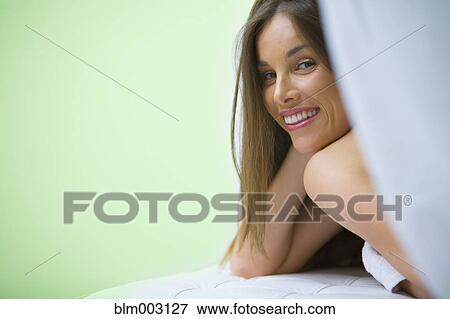 Stock Photo - Mixed race woman waiting for spa treatment. Fotosearch