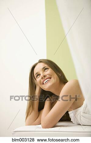Mixed race woman waiting for spa treatment View Large Photo Image Stock Photo - Mixed race woman waiting for spa treatment. Fotosearch