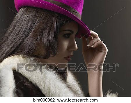 Mixed Race woman wearing hat and fur coat View Large Photo Image Stock Image - Mixed Race woman wearing hat and fur coat. Fotosearch