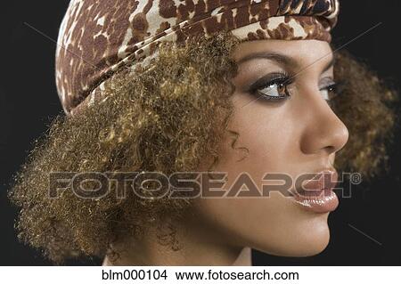 Picture - Mixed Race woman wearing hat. Fotosearch