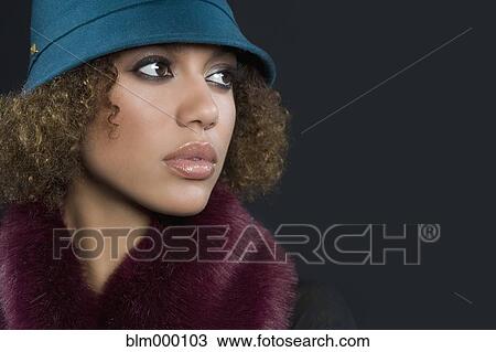 Mixed Race woman wearing hat View Large Photo Image Stock Image - Mixed Race woman wearing hat. Fotosearch
