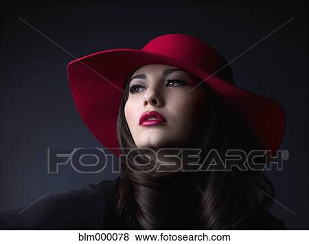 Mixed Race woman wearing hat View Large Photo Image Stock Photo - Mixed Race woman wearing hat. Fotosearch