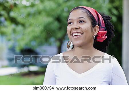 Mixed race woman wearing traditional headscarf View Large Photo Image Picture - Mixed race woman wearing traditional headscarf. Fotosearch