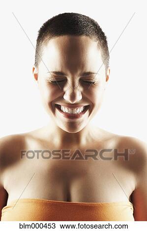 Stock Image - Mixed race woman with eyes closed. Fotosearch