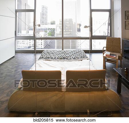 Stock Photography - Modern bedroom in luxury highrise apartment. Fotosearch