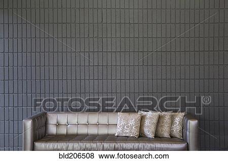 Stock Photo - Modern Sofa Against a Brick Wall. Fotosearch