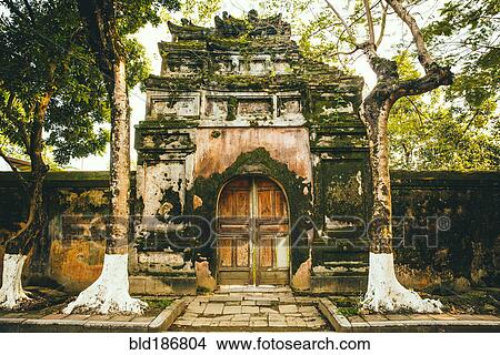Picture - Mossy ornate archway and fence. Fotosearch