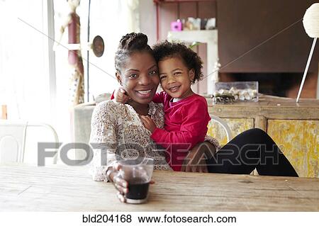 Stock Photo - Mother and daughter relaxing together. Fotosearch