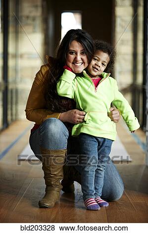 Mother and daughter smiling in hallway View Large Photo Image Stock Photo - Mother and daughter smiling in hallway. Fotosearch