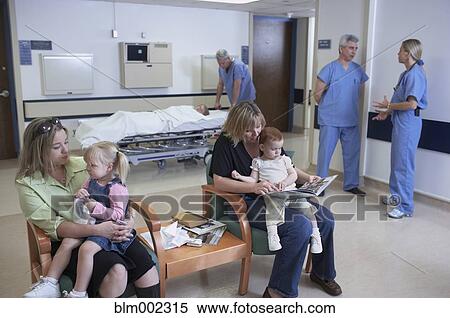 Stock Photography - Mothers and children in hospital waiting room. Fotosearch