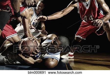Multi-ethnic basketball players struggling for basketball View Large Photo Image Stock Image - Multi-ethnic basketball players struggling for basketball. Fotosearch